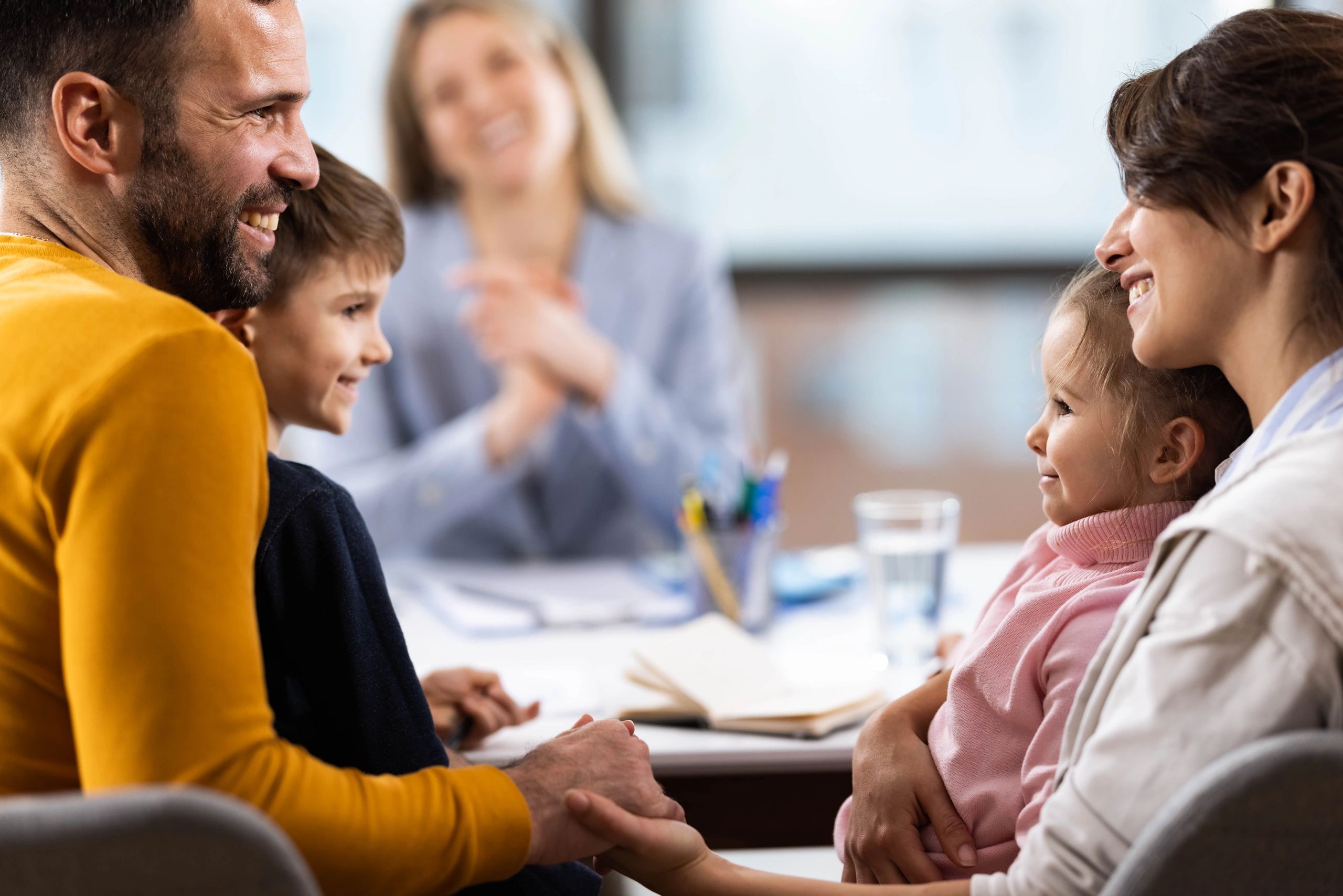 Family meeting with therapist in an office