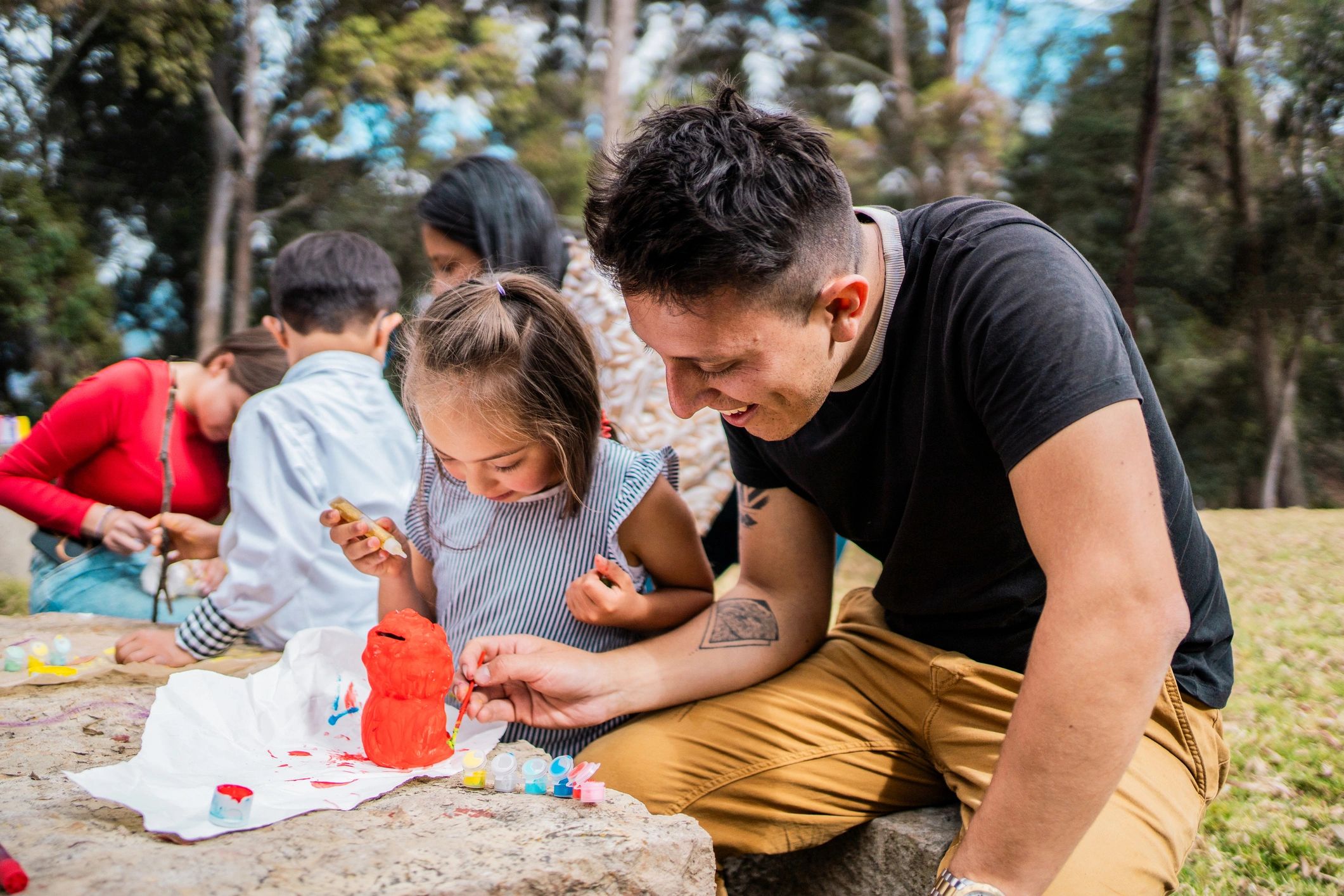 Supportive parent helping child with a hands-on activity
