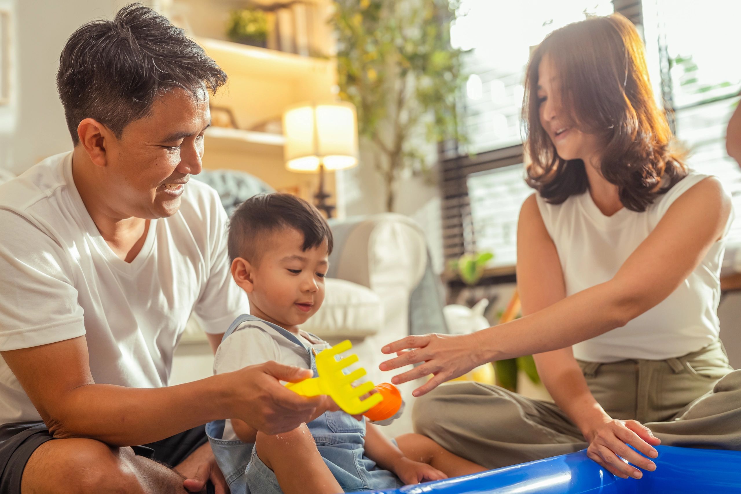 Family engaging in supportive sensory play together